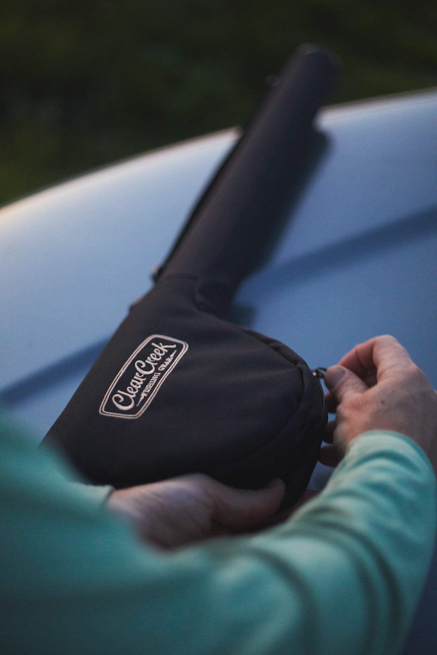Clear Creek portable rod case demonstrates easy carry with a strap during day trips.