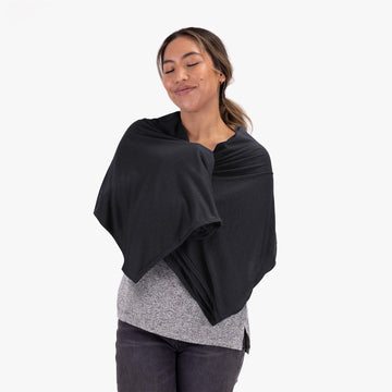COCOON Coolmax travel blanket on airplane delivering consistent comfort