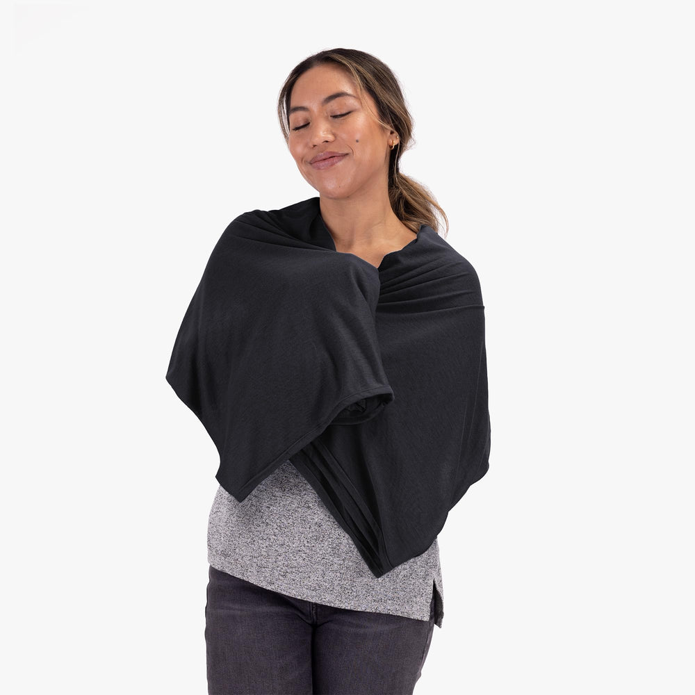 COCOON Coolmax travel blanket on airplane delivering consistent comfort