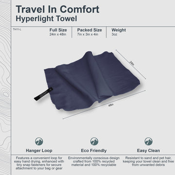 COCOON Hyperlight Towel Lava Grey on the beach resists sand and pet hair.