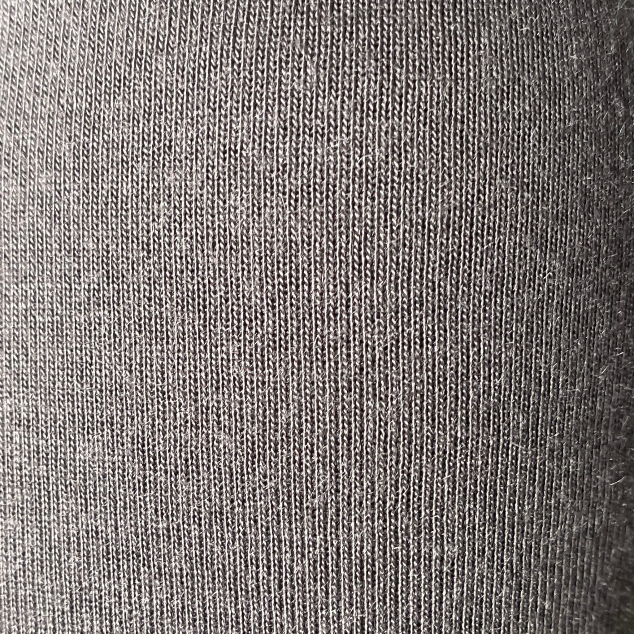 COCOON Premium Coolmax Travel Blanket charcoal on plane provides cozy warmth during flights