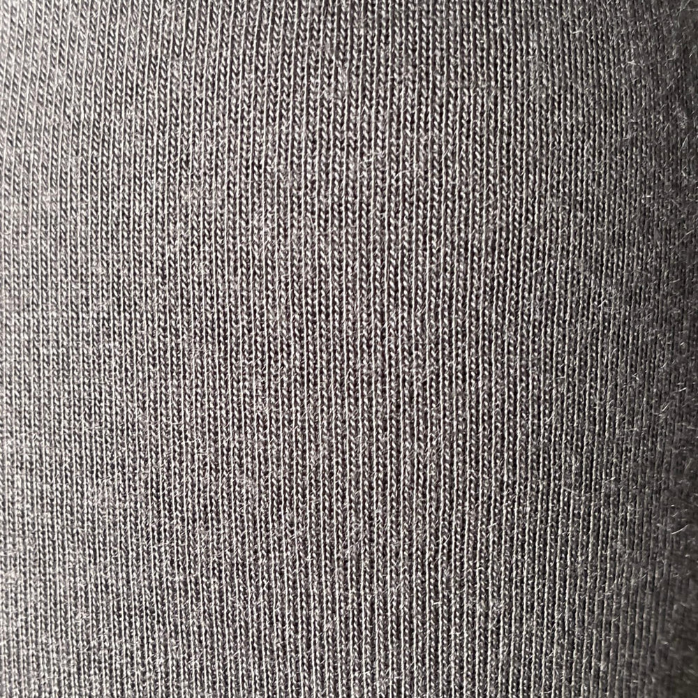 COCOON Premium Coolmax Travel Blanket charcoal on plane provides cozy warmth during flights