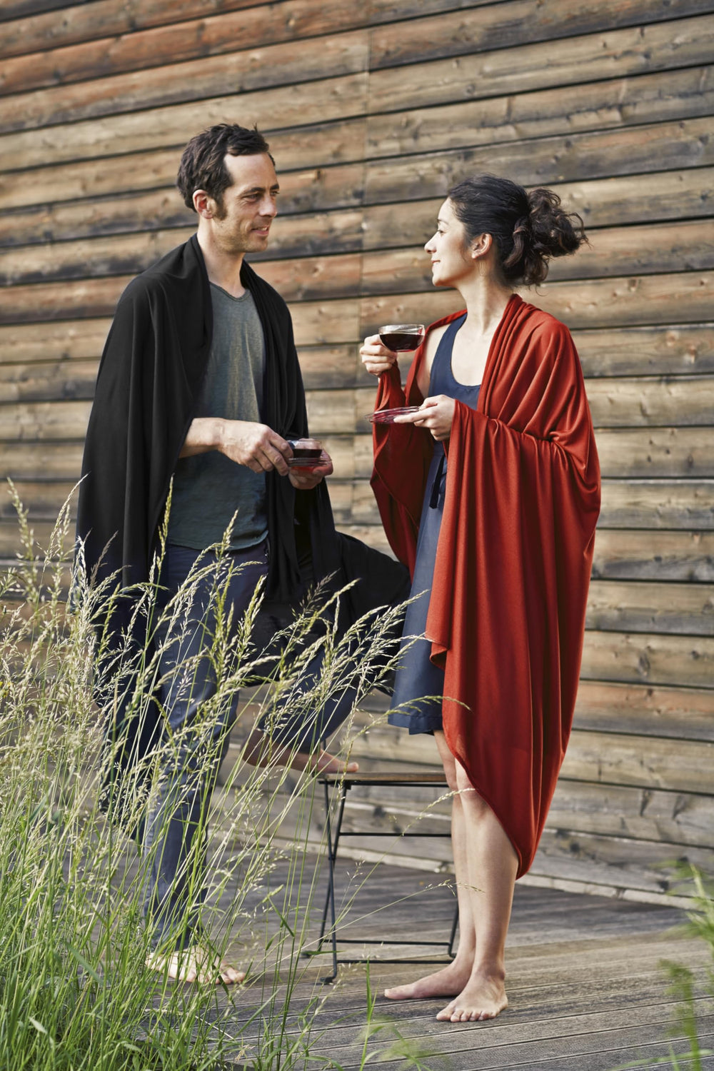 Cocoon Merino Wool/Silk Travel Blanket draped on a bed showing luxurious warmth.