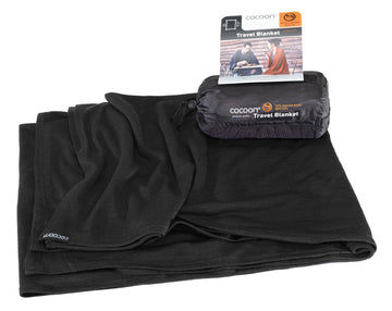 Cocoon travel blanket folded in its compact stuff sack for easy packing.