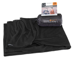 Cocoon travel blanket folded in its compact stuff sack for easy packing.