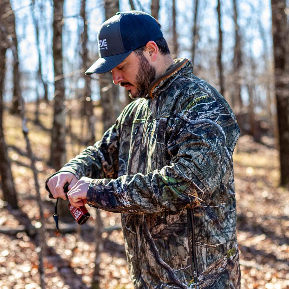 Code Red Doe Urine in a natural hunting setting illustrating season-long attractant use.