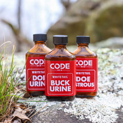 Code Blue Doe Estrous bottle highlighting an attractant for scrapes and drags