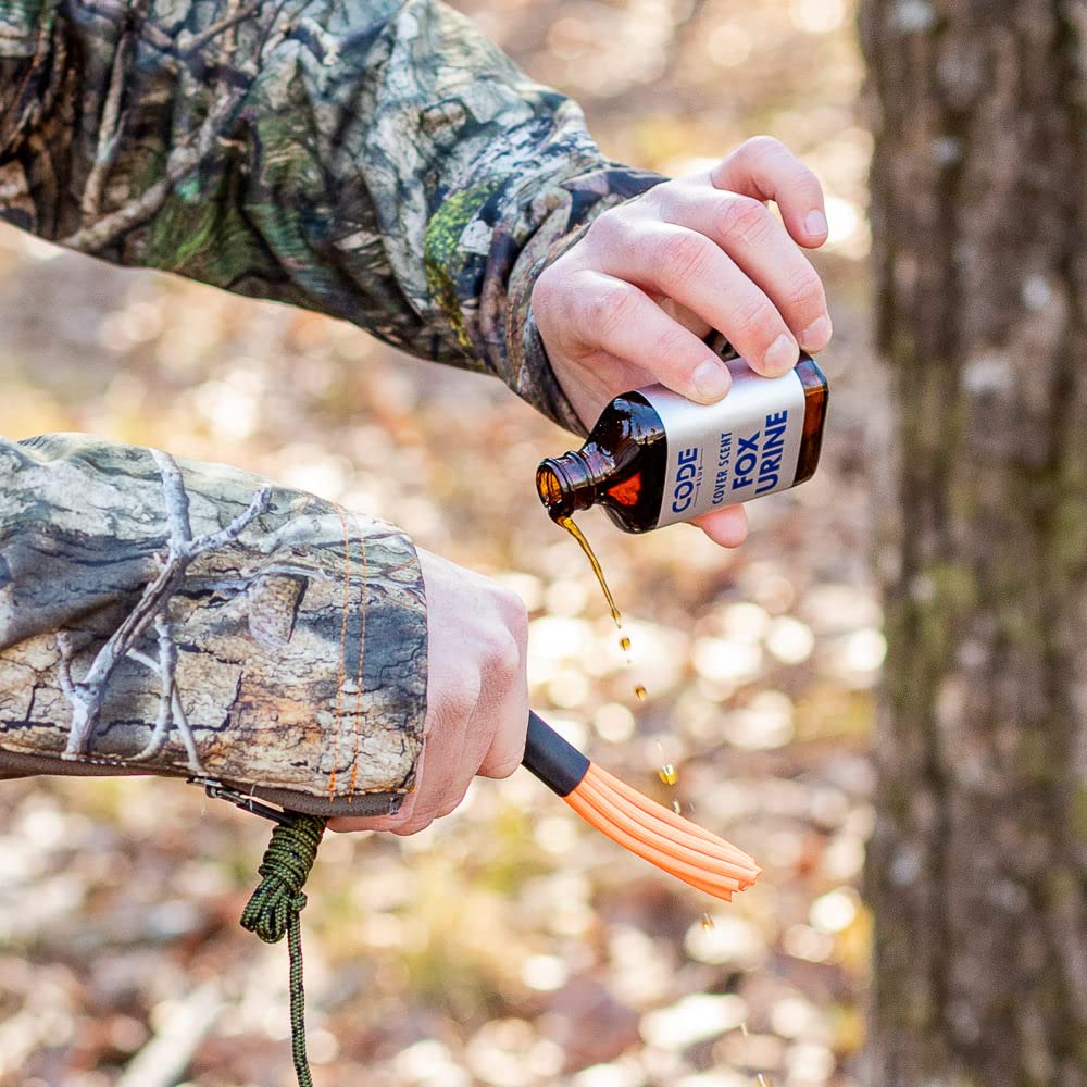 Outdoor hunting scene showing Code Blue Fox Urine as cover scent