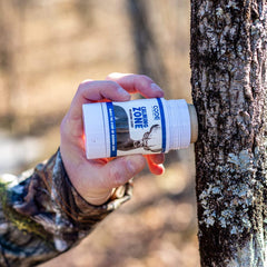 Code Blue Calming Zone scent stick on brush ready for deer scenting.