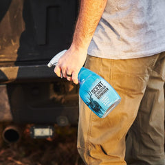 Code Blue unscented 24oz field spray bottle in outdoor setting.