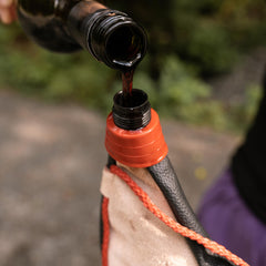 Braided strap of Coghlan's bota bag ready for comfortable hiking carry.