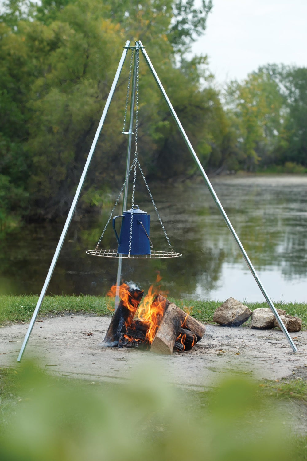 Coghlan's 17-inch grill handles burgers and veggies over campfire