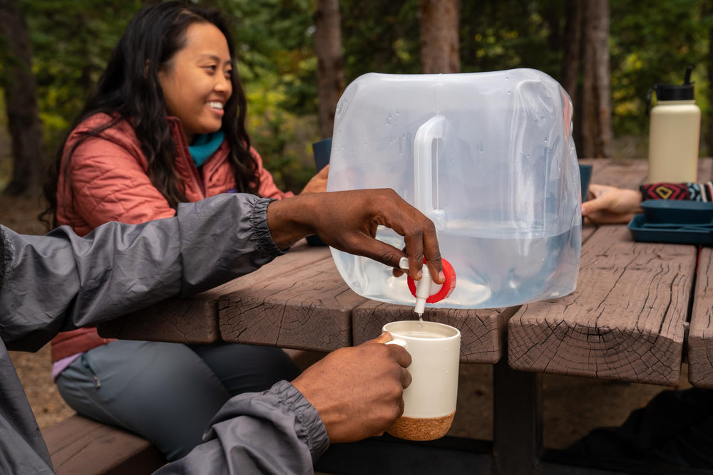 Coghlan's collapsible water container folded empty fits in a backpack