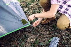 Coghlan's nylon repair tape applied to jacket elbow, demonstrating color blend and durable patch.