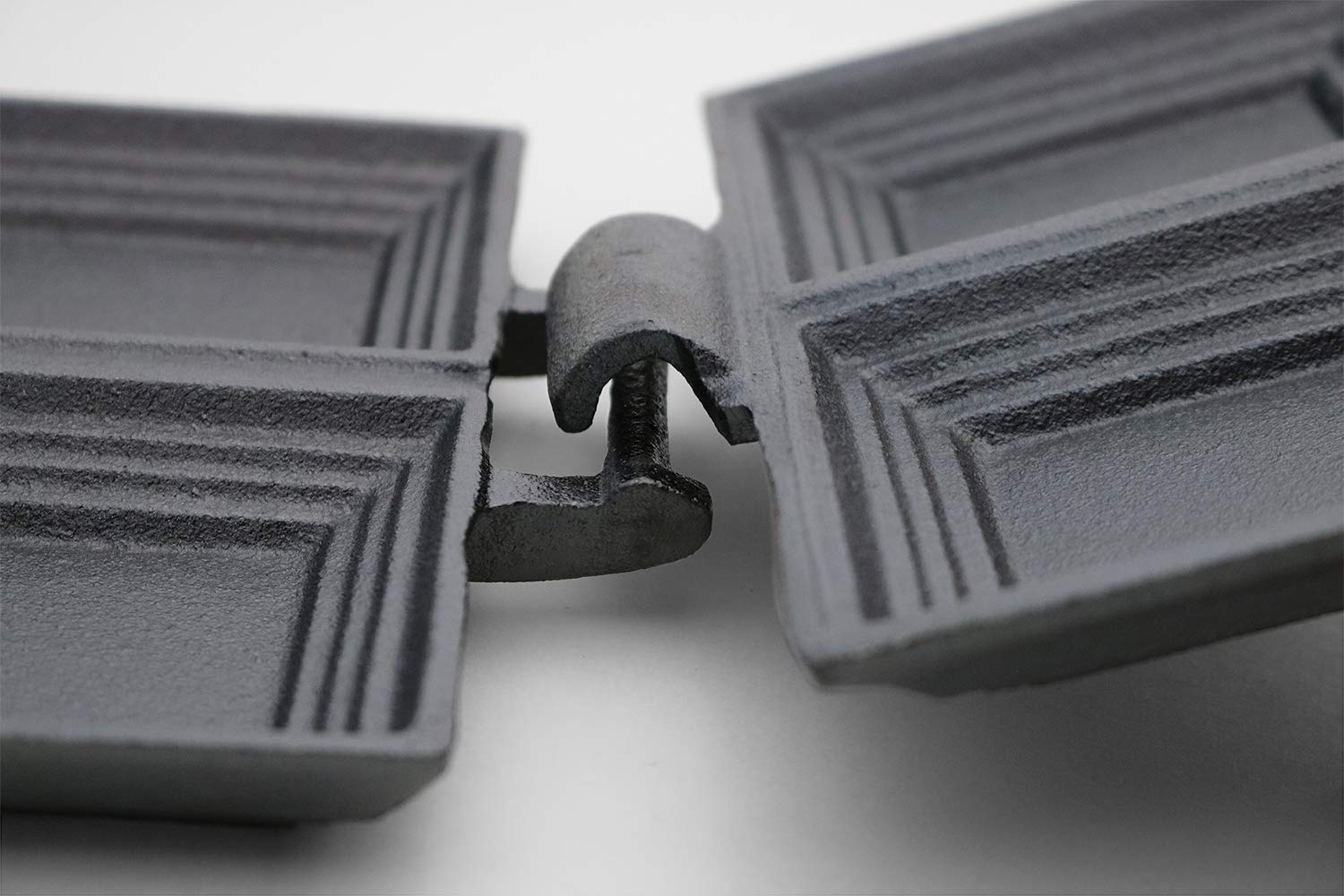 Coghlan's S-clip locking mechanism keeps cooker secure while cooking.