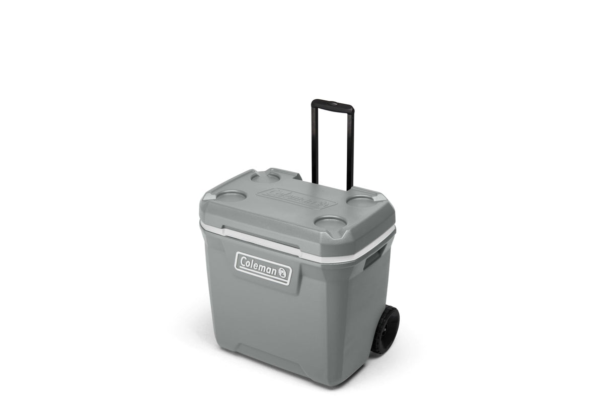 Coleman 316 Series 65-Quart wheeled cooler outdoors for easy transport