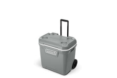 Coleman 316 Series 65-Quart wheeled cooler outdoors for easy transport