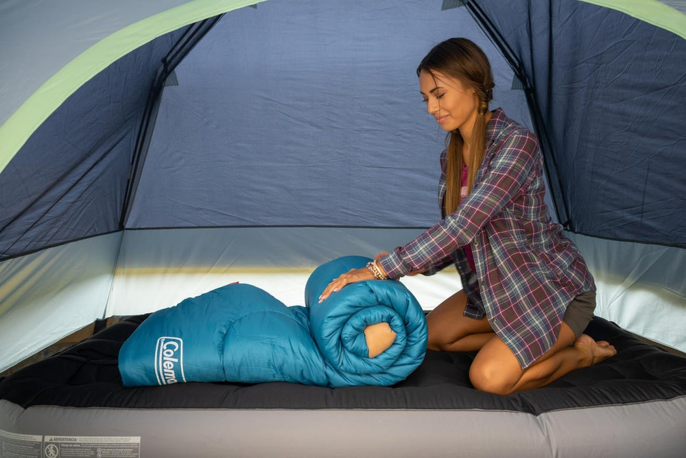 Coleman Brazos roll-control fasteners keep bag straight during packing.