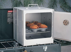 Coleman Camp Oven Silver side view highlights compact footprint for camping.