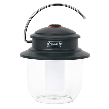 Coleman Classic 800L lantern on a table provides bright campsite lighting.