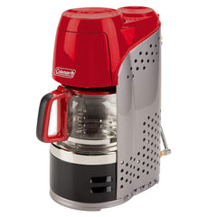 Coleman coffeemaker red glass carafe for camping mornings and shared coffee.