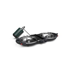 Coleman Fold N Go stove in compact folded form for portable campsite setup.