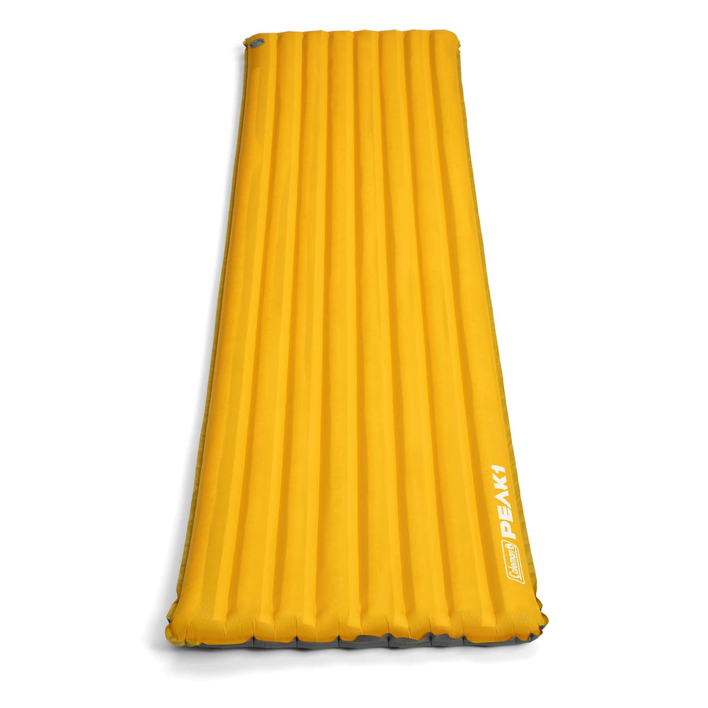Coleman PEAK1 sleeping camp pad with integrated valve for quick inflation.