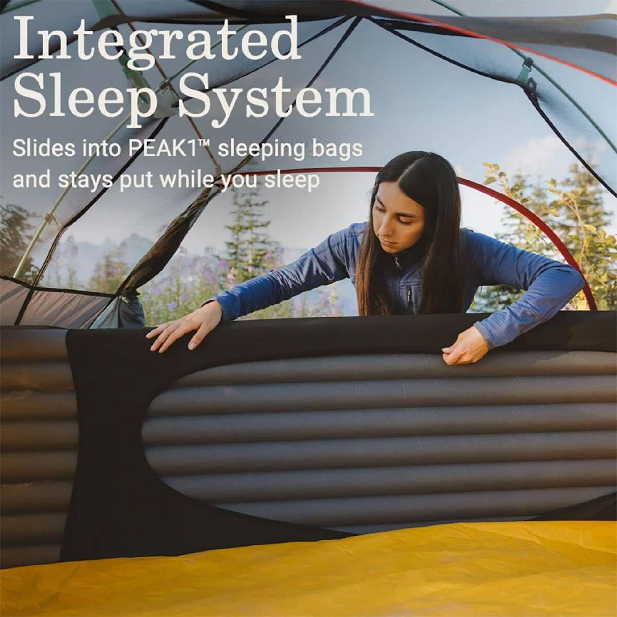 Coleman PEAK1 sleeping pad in use during a backpacking trip for comfort.