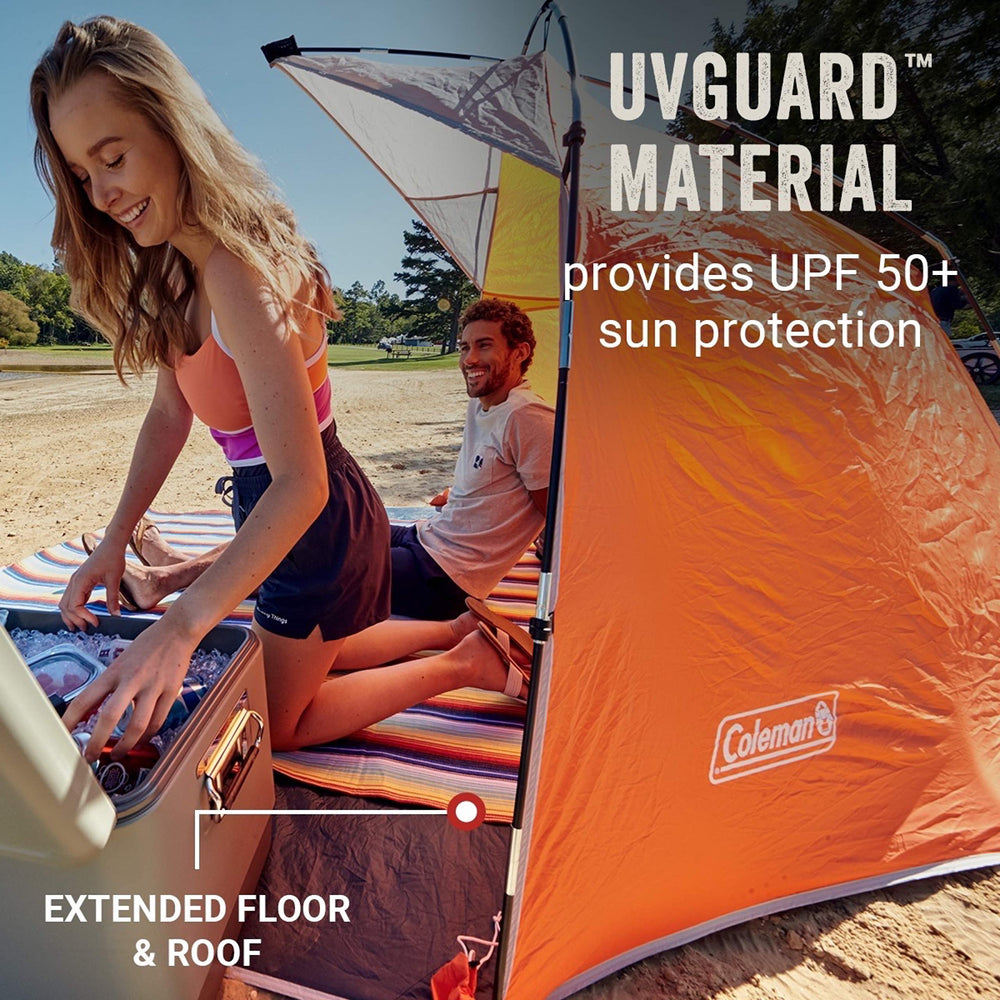 Coleman Skyshade demonstrates wind-stable setup with stakes and sandbags.