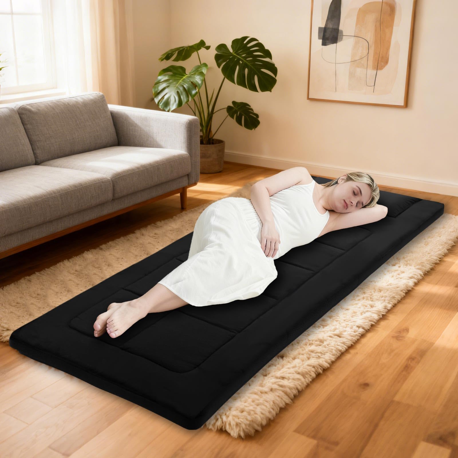 COLMERD XXL floor mattress in tent offers roomy sleeping space.