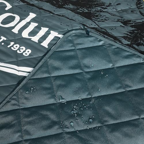 Columbia packable tote blanket showing built-in handles and velcro closure for portability.