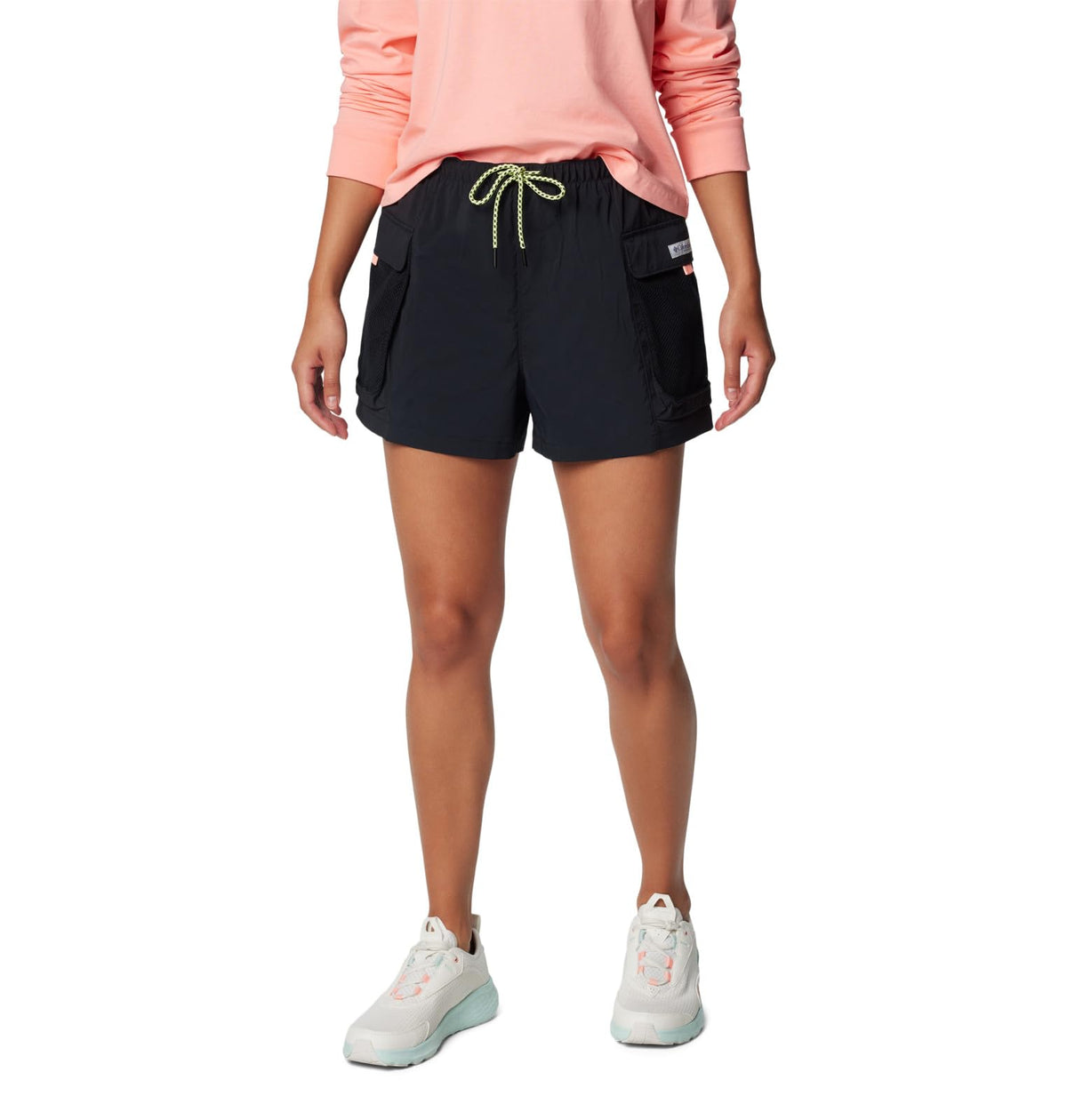 Columbia Women's PFG Open Water Short black on the beach showing sun protection and quick-dry comfort