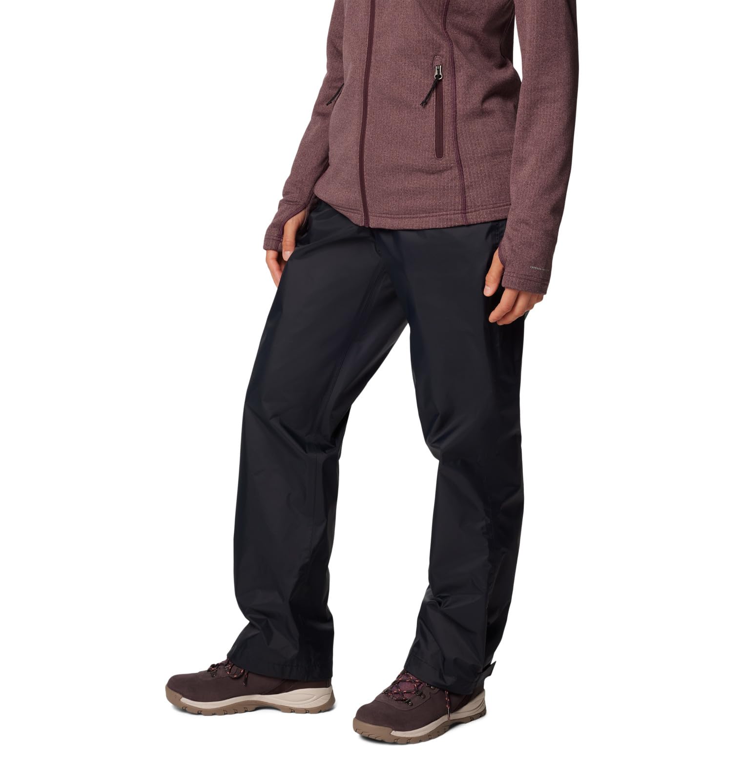 Columbia Storm Surge II pants packed in a hiking pack for travel-ready rain protection