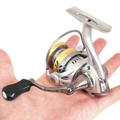 Compact spinning reel on ice in gold finish with foldable handle