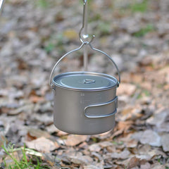 COMTAI titanium pot with foldable bail handle for hanging over a campfire