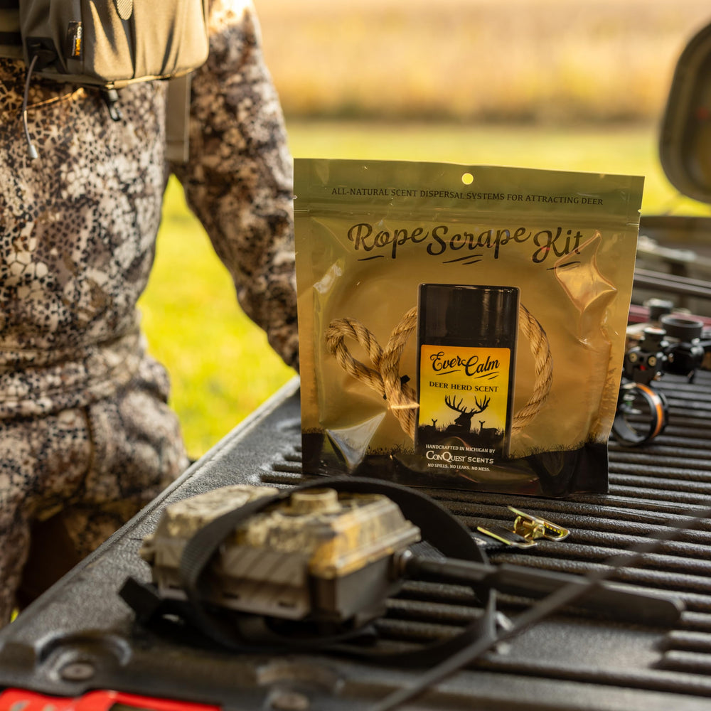 Conquest Scents mock scrape licking branch setup demonstrates high-traffic deer activity.