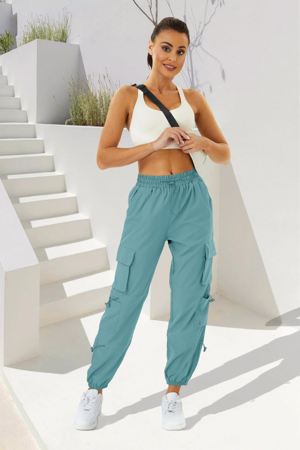 Copyleaf womens parachute cargo pants lake blue pocket detail highlights reinforced storage during adventures