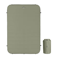 CORE Double Self Inflating Camping Bed unrolled and ready for comfort on a campsite.