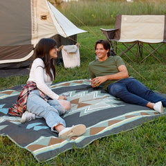 CORE Outdoor Weighted Blanket beach-scene highlights sand-proof surface and built-in portability for quick shade.