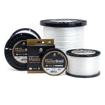 Cortland Master Braid white fishing line on a reel, highlighting strength and long casting potential
