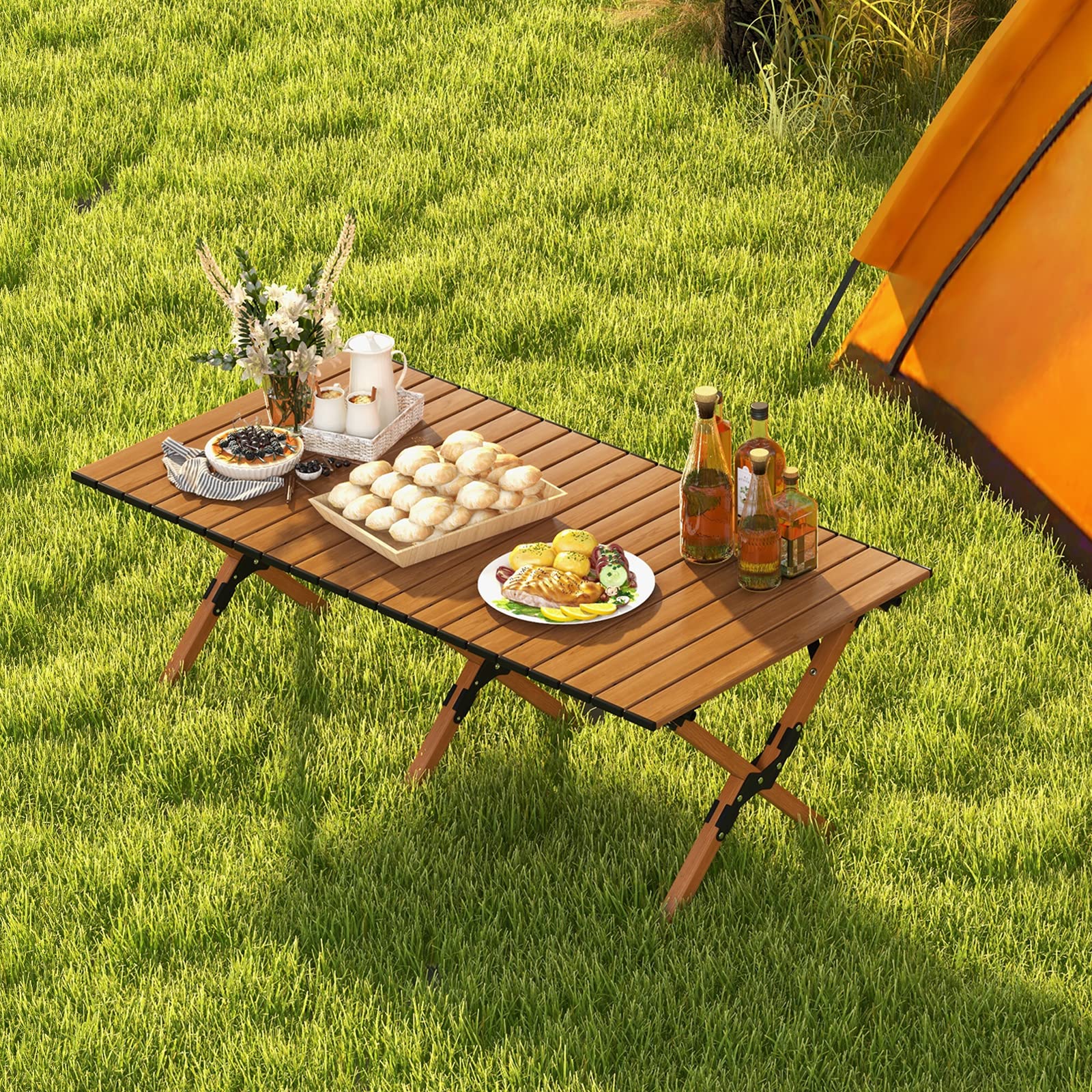 Costway outdoor table in use for picnics, camping, or beach days