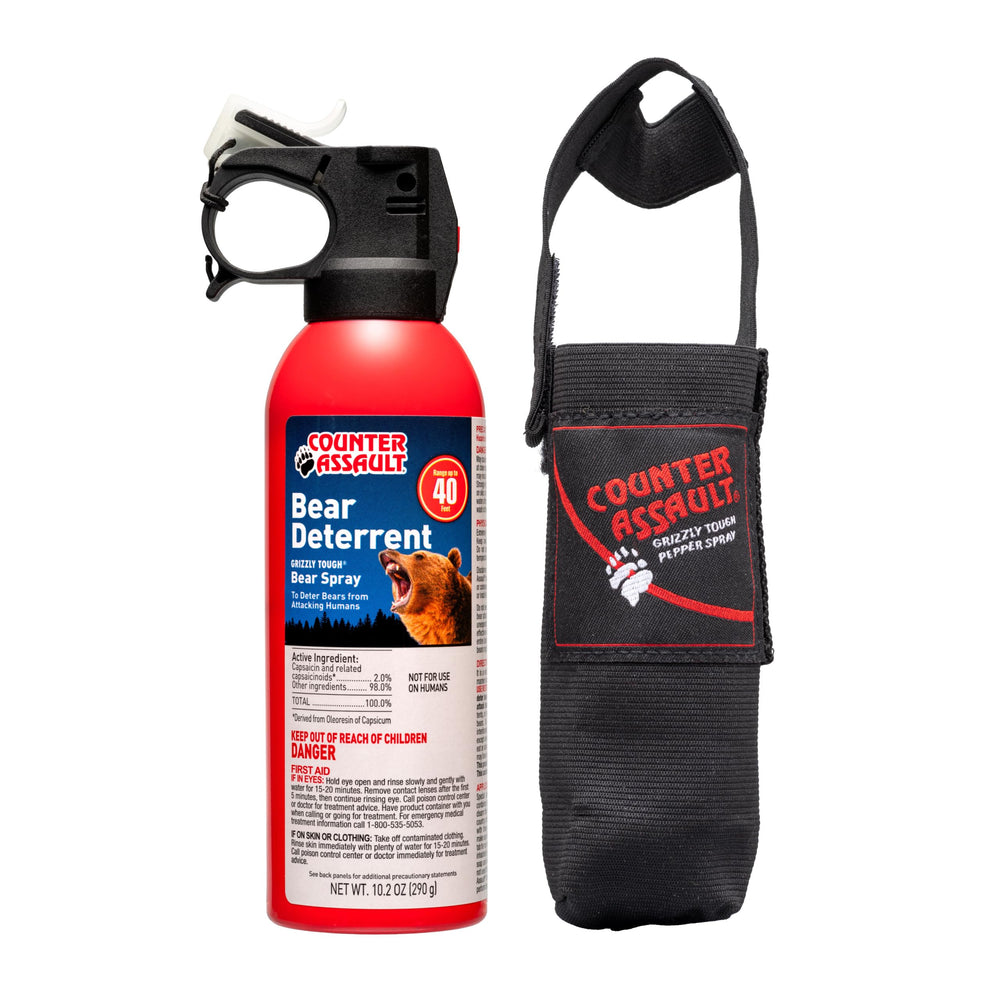 Counter Assault bear spray canister with 40-foot range shown for distance deterrence.