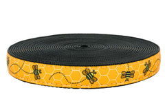 Country Brook Design Busy Bee ribbon on black nylon webbing closeup for durable crafts.