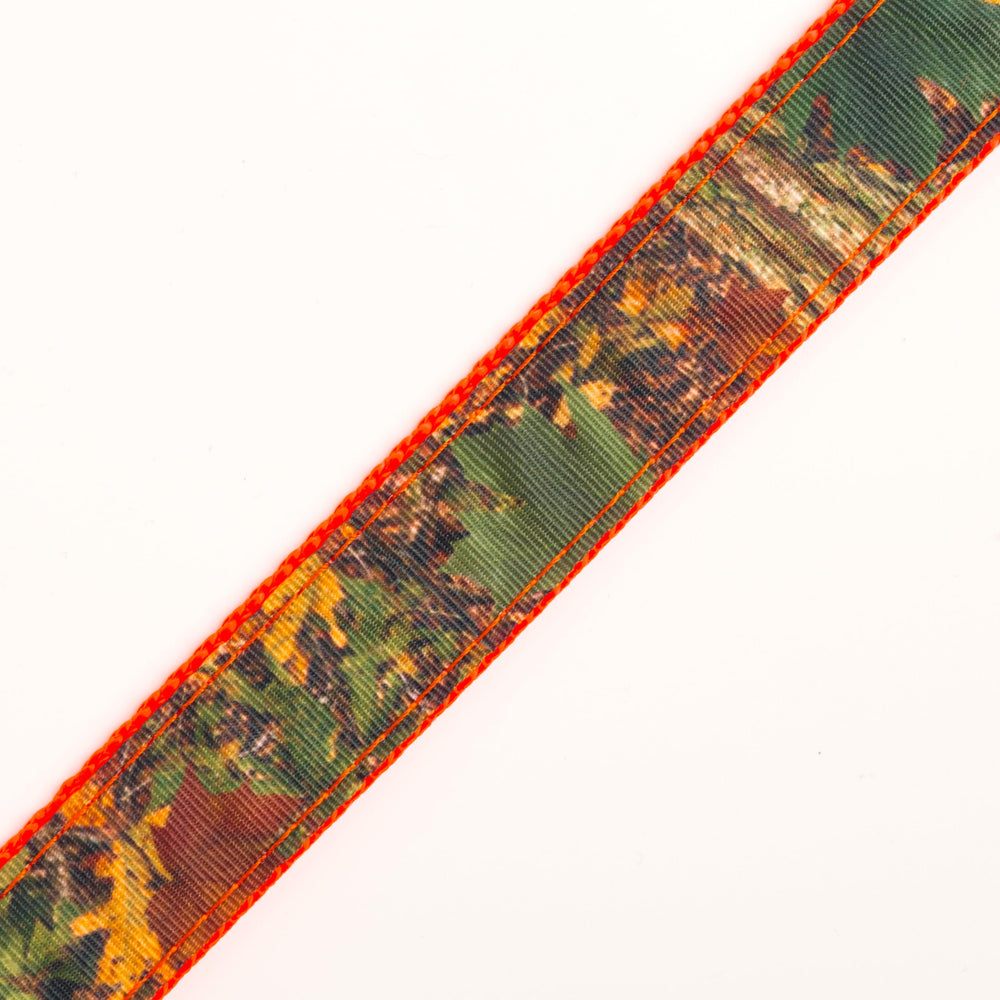 Closeup of Southern Forest Camo ribbon sewn to nylon webbing for sturdy, seamless assembly.