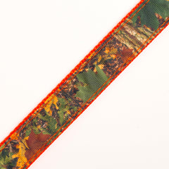 Closeup of Southern Forest Camo ribbon sewn to nylon webbing for sturdy, seamless assembly.