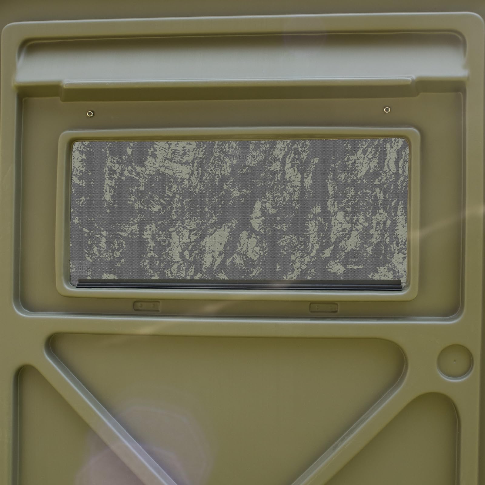 Covertech HD Window Camo being applied to glass for easy alignment.