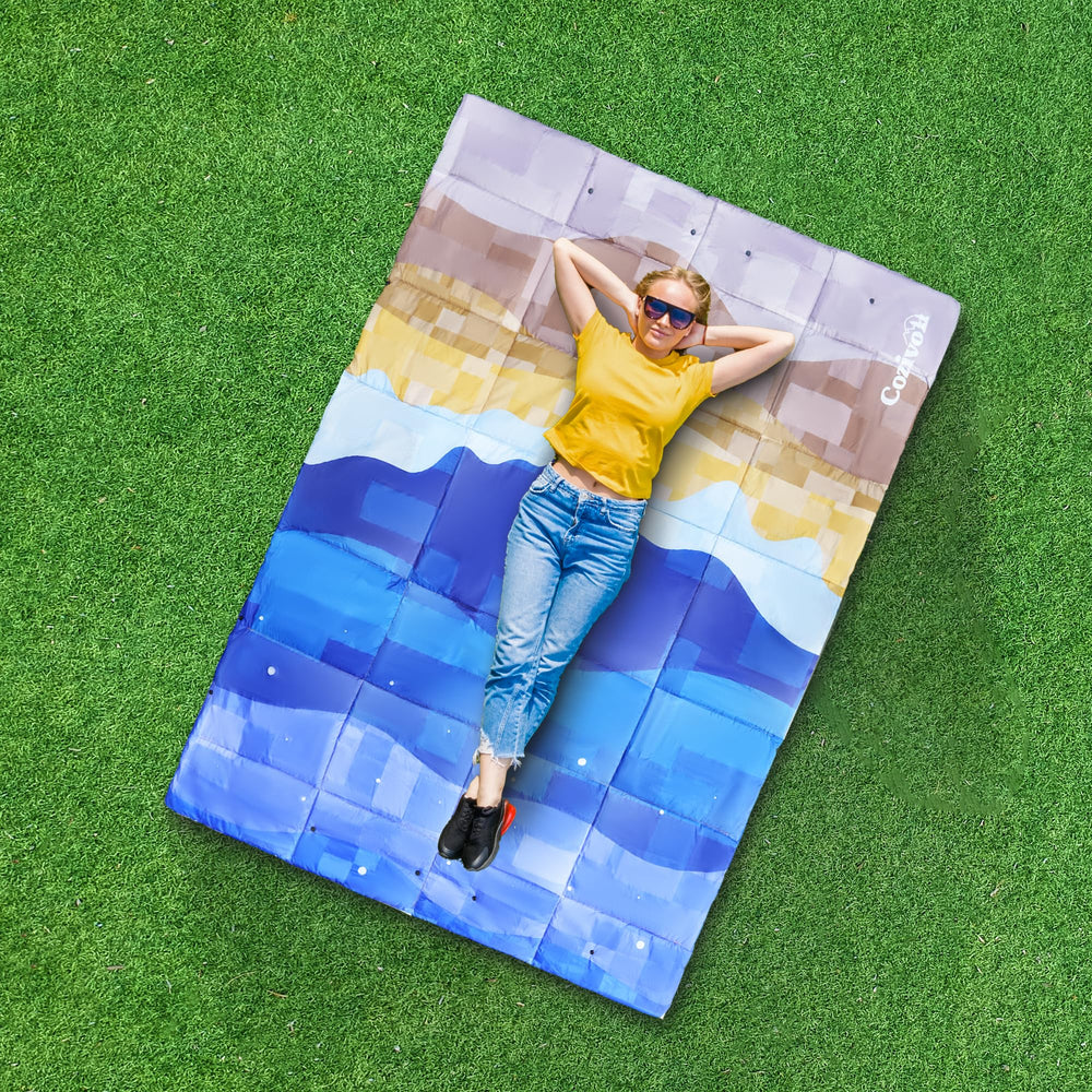 Cozivo camping blanket-stuff-sack shows compact packing for backpack-ready portability.