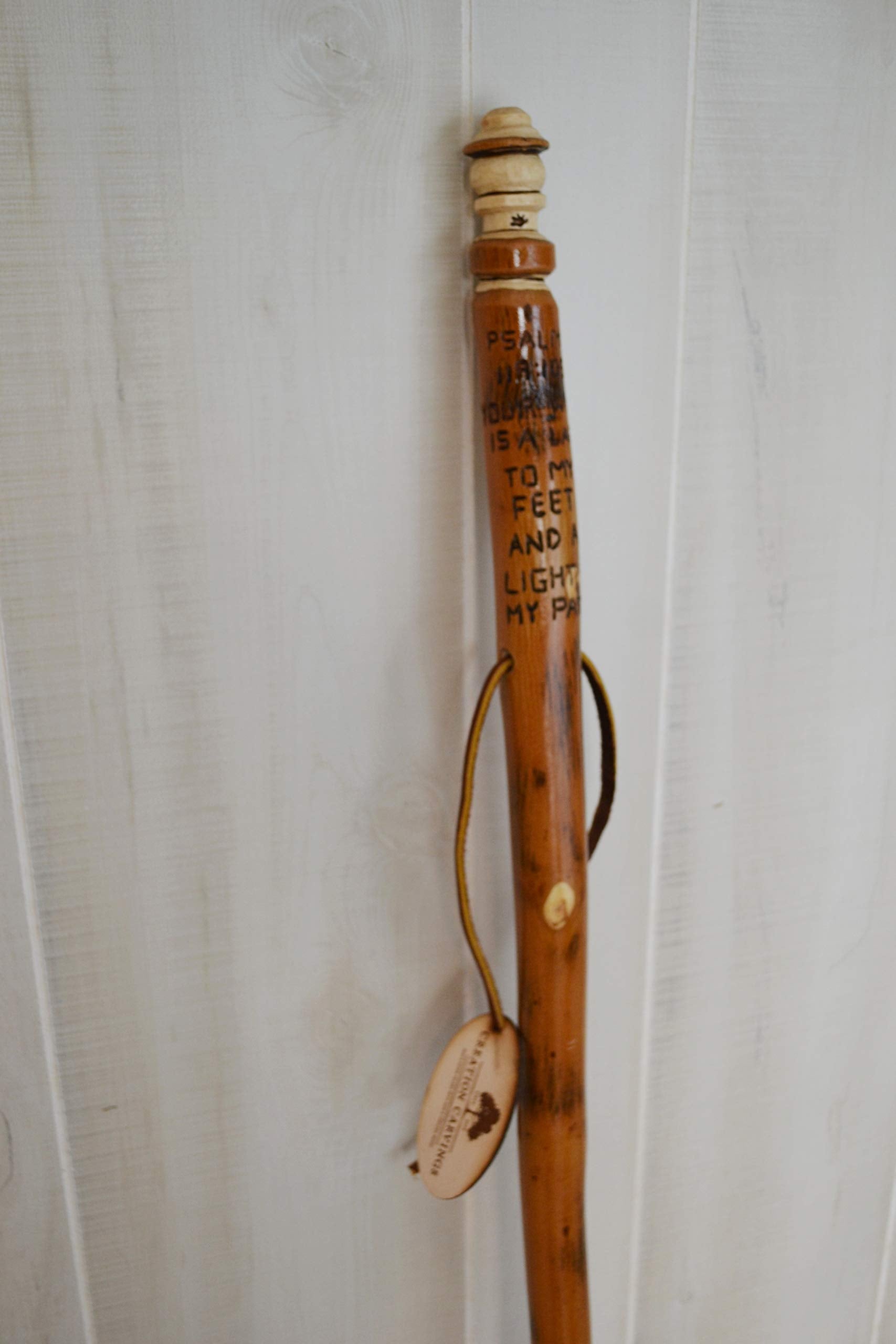 CreationCarvings Bible Walking Stick supports balance during trail use and hikes.