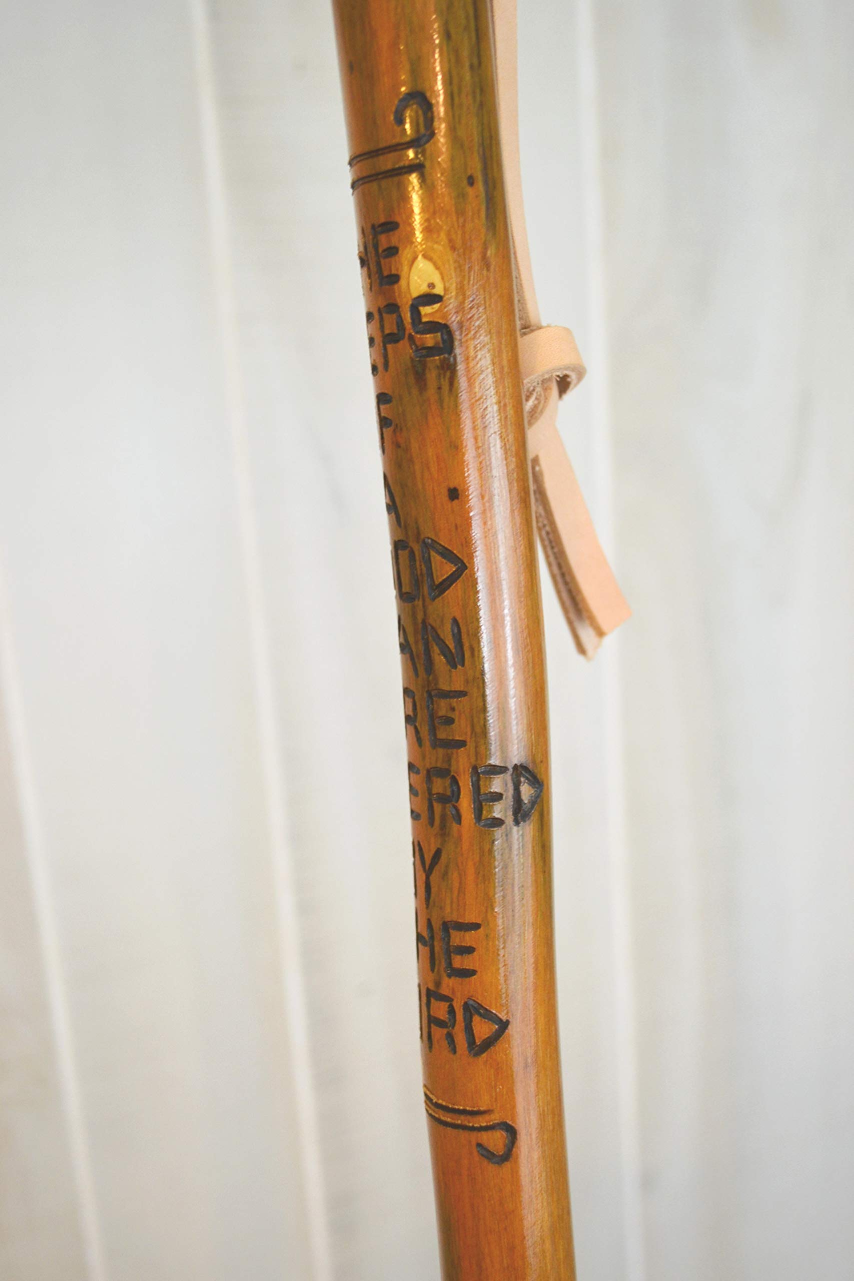 CreationCarvings hardwood walking stick showing adjustable height for a personalized fit.