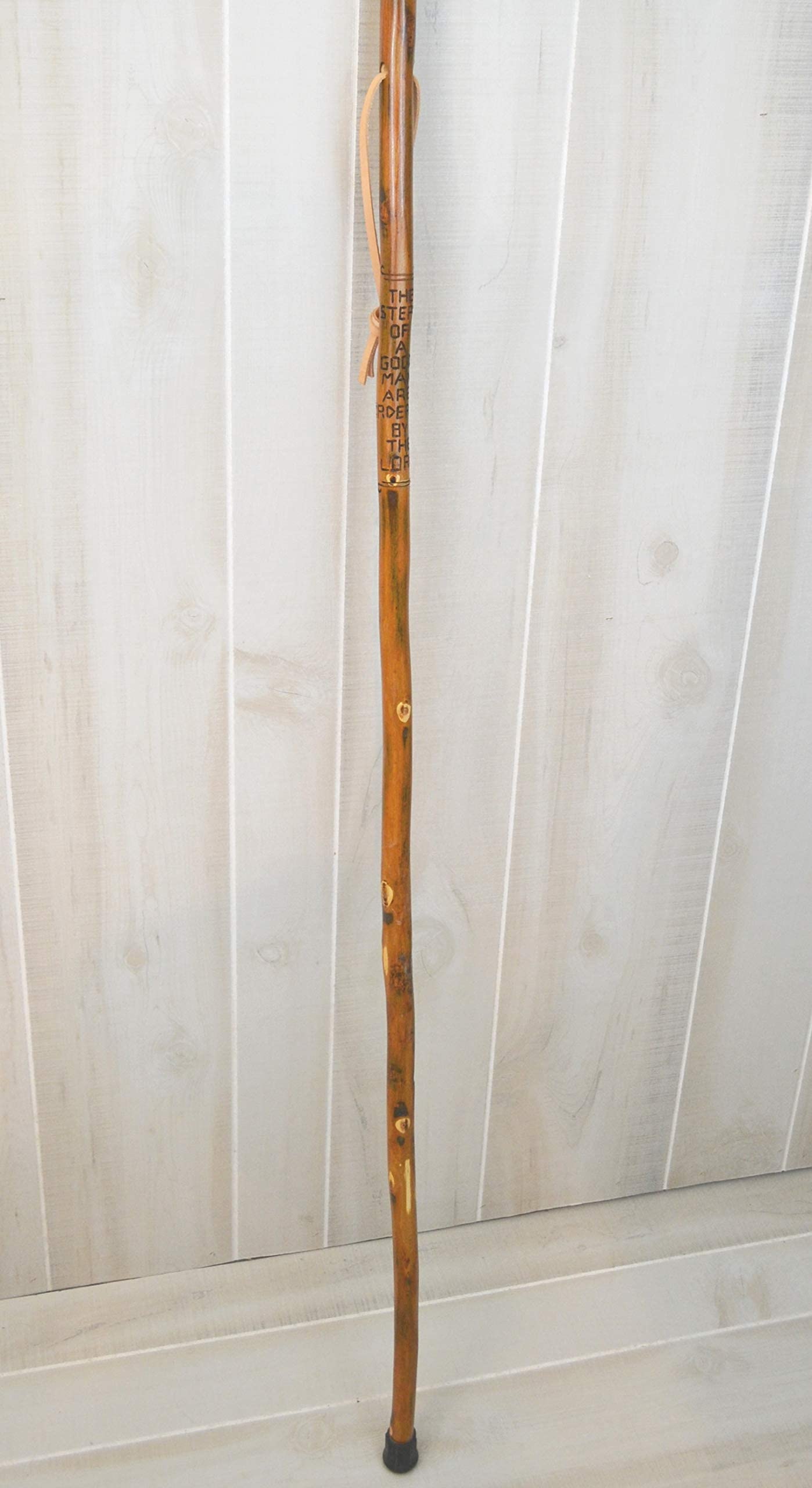 CreationCarvings handcrafted hardwood walking stick showcasing rustic charm.